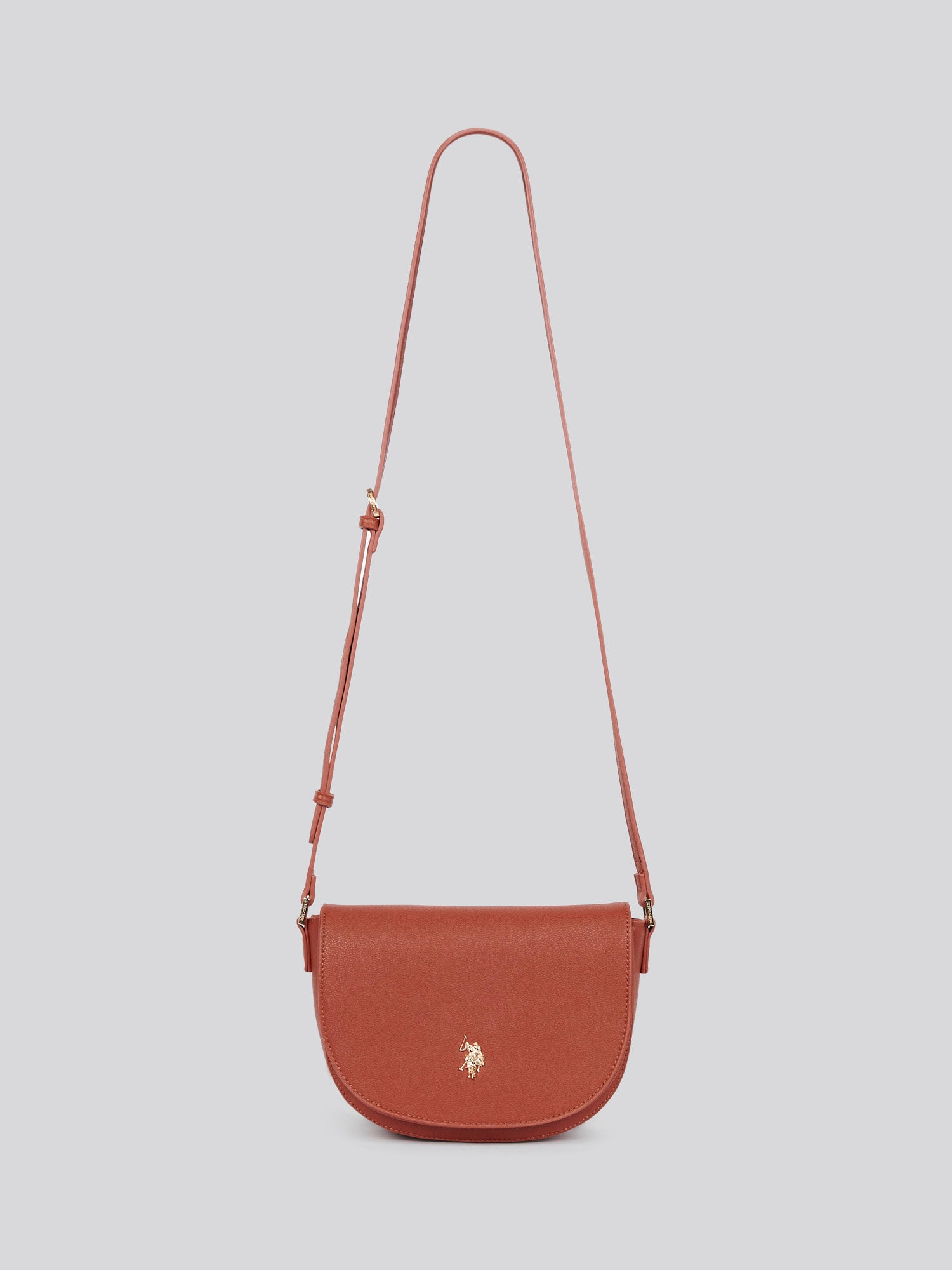 U.S. Polo Assn. Womens Jones Flap Crossbody Bag in Rust