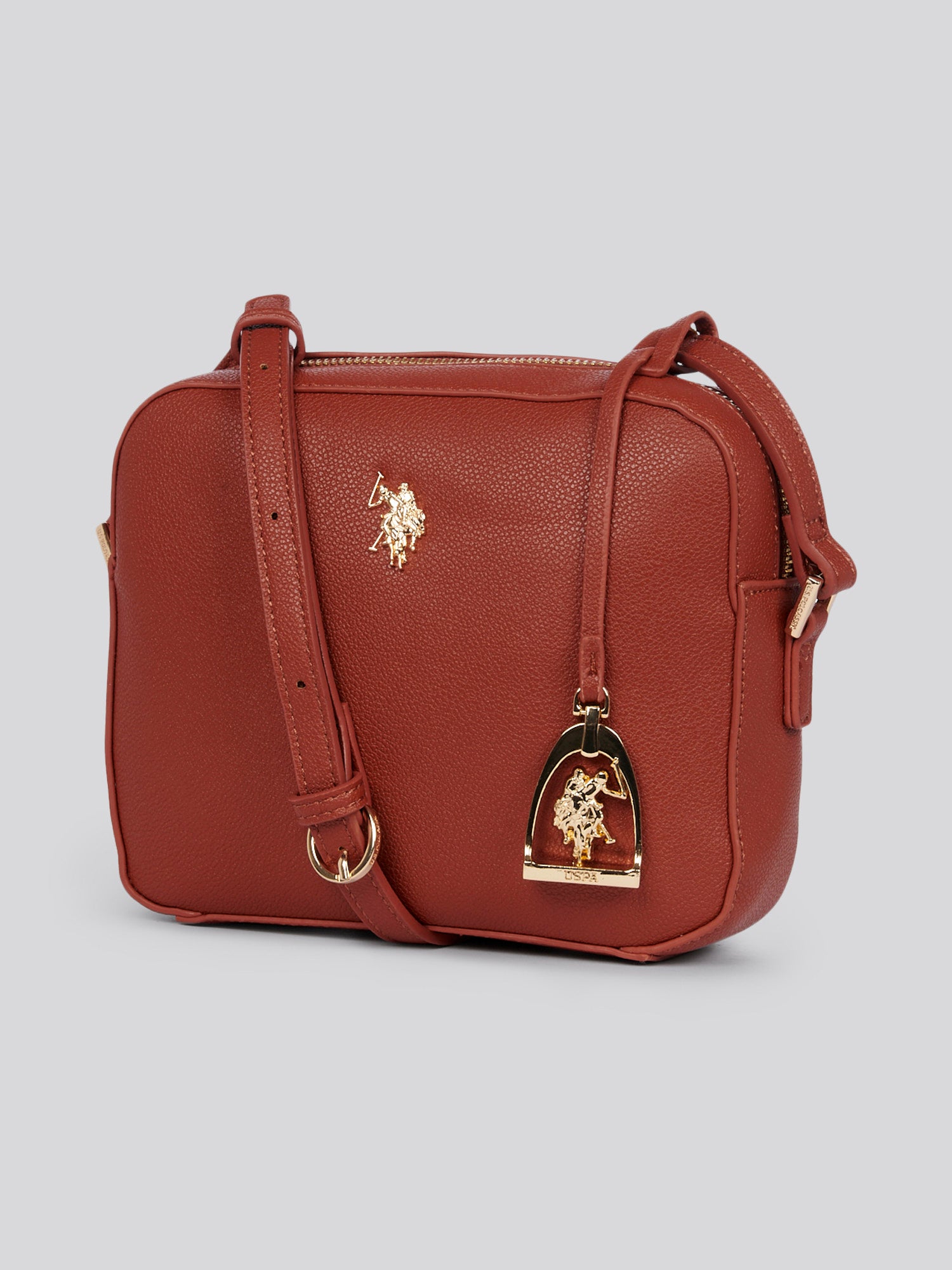 U.S. Polo Assn. Womens Jones Crossbody Bag in Rust